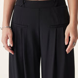 Pantaloni largi cu talie medie, din material Ponte de bambus fluid, cu buzunare.