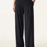 Pantaloni largi cu talie medie, din material Ponte de bambus fluid, cu buzunare.